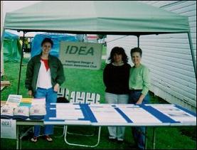 IDEA Club members with a booth set up at a booth fair